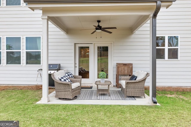 view of patio / terrace with area for grilling, ceiling fan, and an outdoor living space