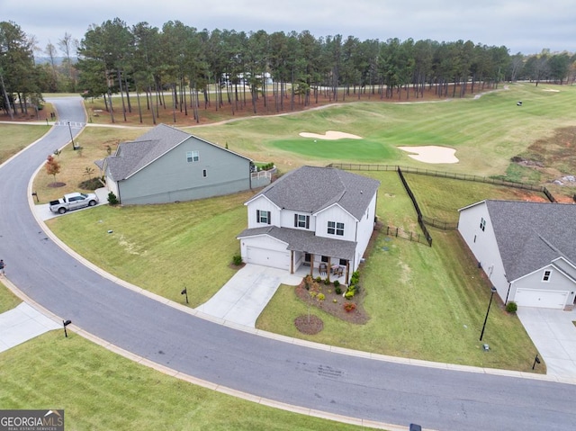 birds eye view of property with golf course view