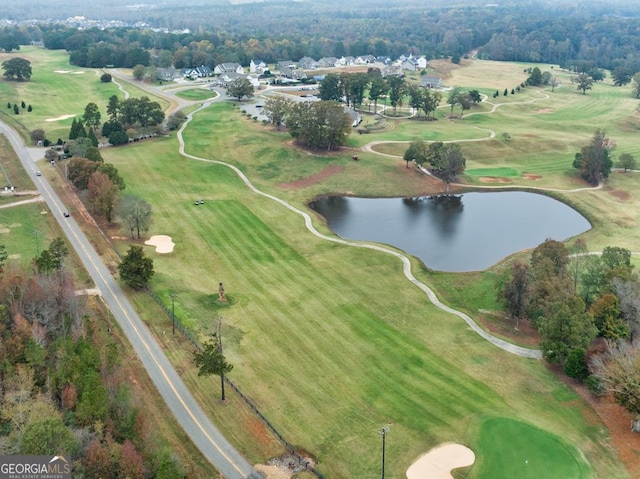 bird's eye view with a water view and golf course view