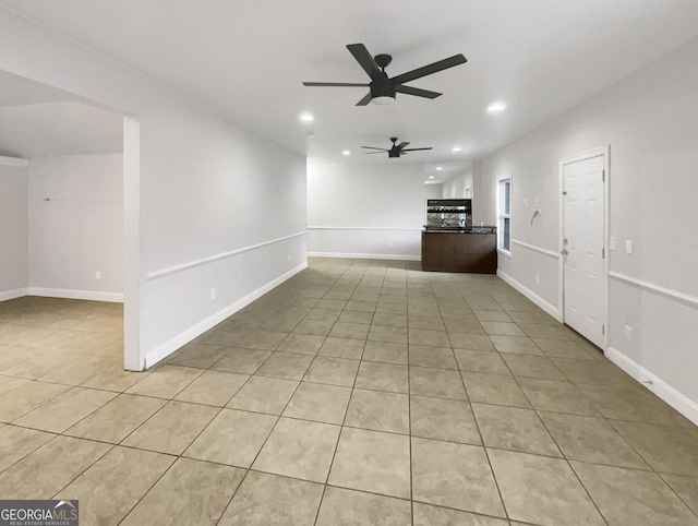 unfurnished living room with recessed lighting, a ceiling fan, baseboards, and light tile patterned floors