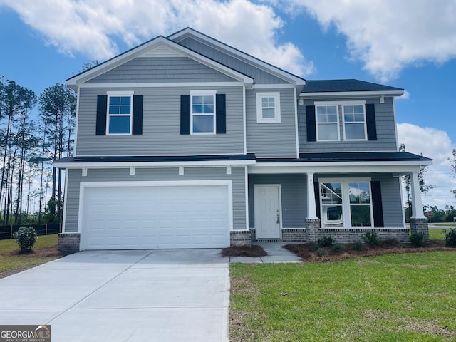 93 Brook Dr, Brunswick, GA 31525 - craftsman inspired home with brick siding, a garage, concrete driveway, a front yard, and a porch