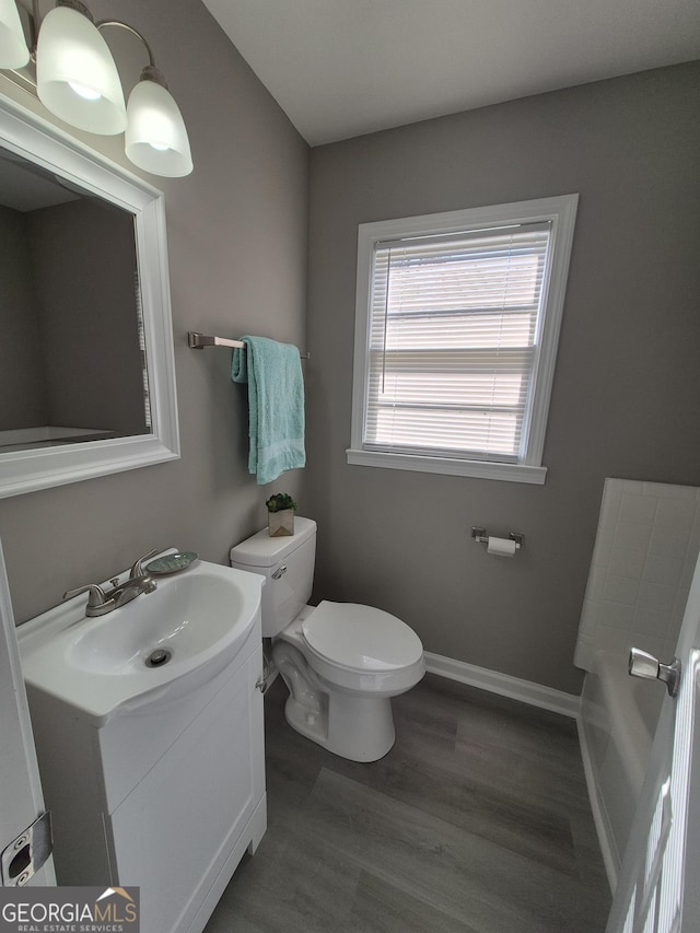 130 Royal Ct, Athens, GA 30601 - bathroom featuring vanity, a tub to relax in, and wood finished floors