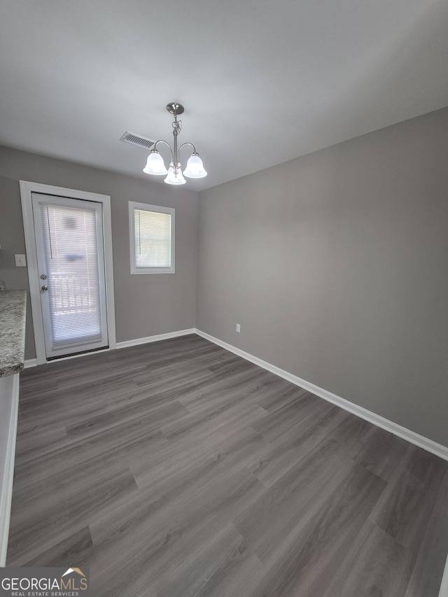 130 Royal Ct, Athens, GA 30601 - unfurnished dining area featuring a chandelier and dark wood-style flooring