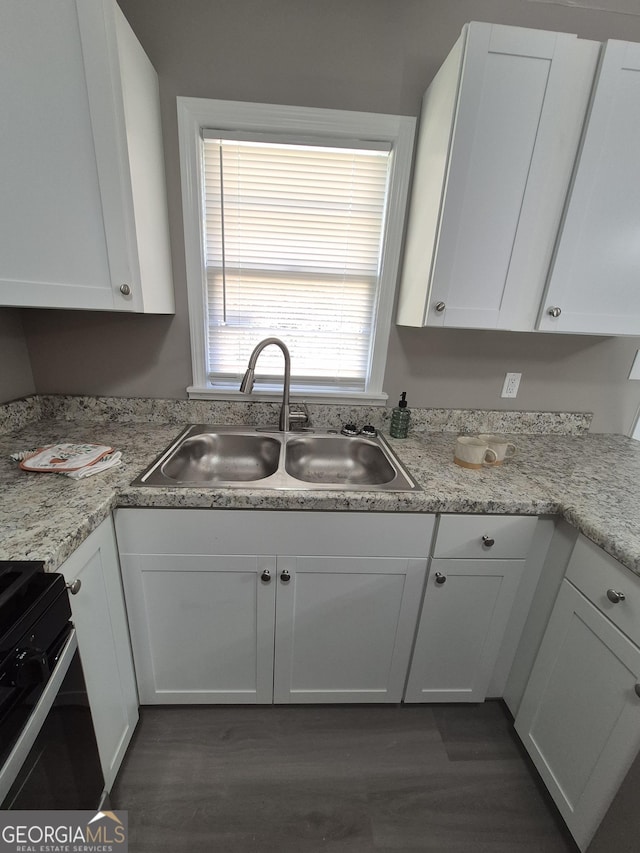 130 Royal Ct, Athens, GA 30601 - kitchen featuring stove, white cabinetry, light countertops, and dark wood-style floors