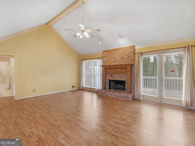 230 Acorn Ct, Mcdonough, GA 30253 - unfurnished living room with ceiling fan, light wood-style flooring, a brick fireplace, and baseboards