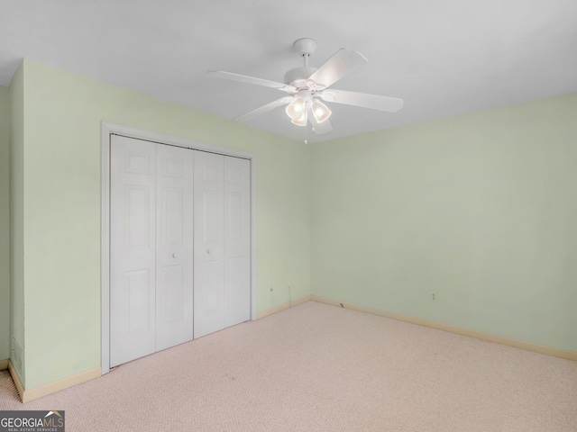 230 Acorn Ct, Mcdonough, GA 30253 - unfurnished bedroom featuring carpet, a closet, baseboards, and ceiling fan
