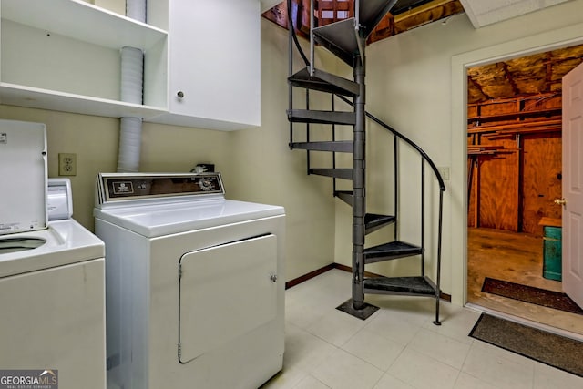 508 Sterrett Rd, Tiger, GA 30576 - clothes washing area with washing machine and dryer, cabinet space, and baseboards