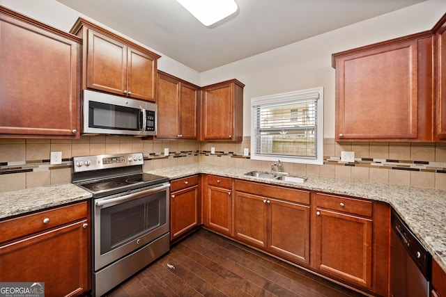 249 Madison Ave, Acworth, GA 30102 - kitchen featuring stainless steel appliances, a sink, light stone countertops, tasteful backsplash, and dark wood-style flooring