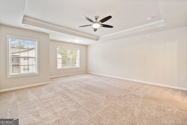 249 Madison Ave, Acworth, GA 30102 - carpeted spare room with a tray ceiling, visible vents, a ceiling fan, ornamental molding, and baseboards