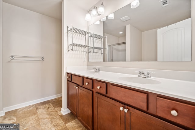 249 Madison Ave, Acworth, GA 30102 - bathroom with a shower stall, baseboards, a sink, and visible vents