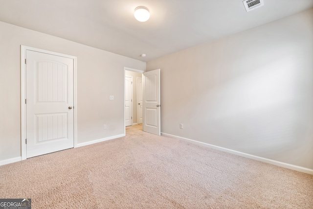 249 Madison Ave, Acworth, GA 30102 - unfurnished bedroom with baseboards, light carpet, and visible vents
