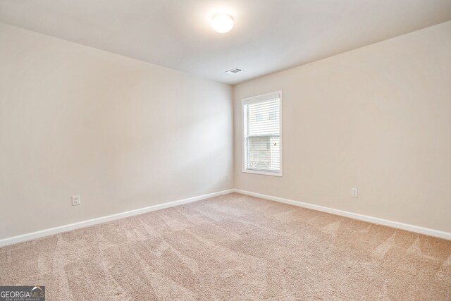 249 Madison Ave, Acworth, GA 30102 - unfurnished room featuring visible vents, baseboards, and light colored carpet