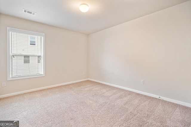249 Madison Ave, Acworth, GA 30102 - spare room featuring visible vents, carpet flooring, and baseboards