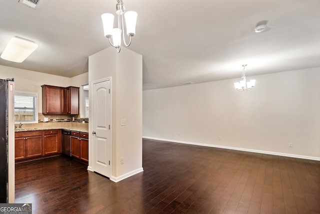 249 Madison Ave, Acworth, GA 30102 - kitchen with a notable chandelier, baseboards, dark wood-style flooring, light stone countertops, and visible vents