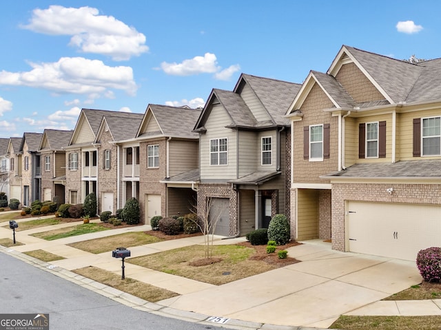 249 Madison Ave, Acworth, GA 30102 - multi unit property featuring brick siding, a residential view, an attached garage, and driveway