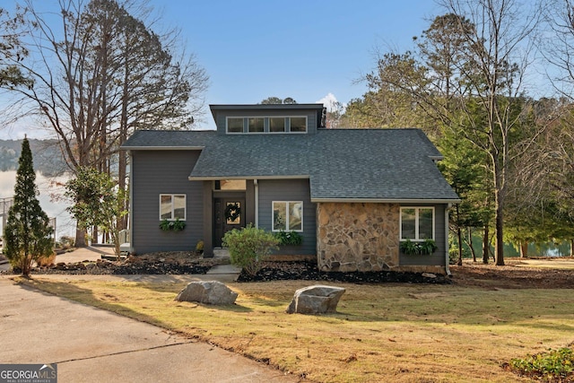 1190 Plantation Dr, Villa Rica, GA 30180 - mid-century home featuring stone siding, a front lawn, and roof with shingles