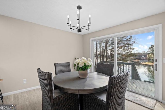 1190 Plantation Dr, Villa Rica, GA 30180 - dining room with a notable chandelier and baseboards