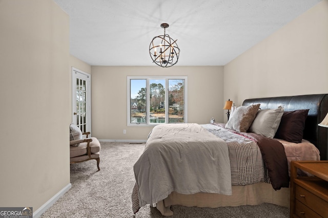 1190 Plantation Dr, Villa Rica, GA 30180 - carpeted bedroom with baseboards and an inviting chandelier