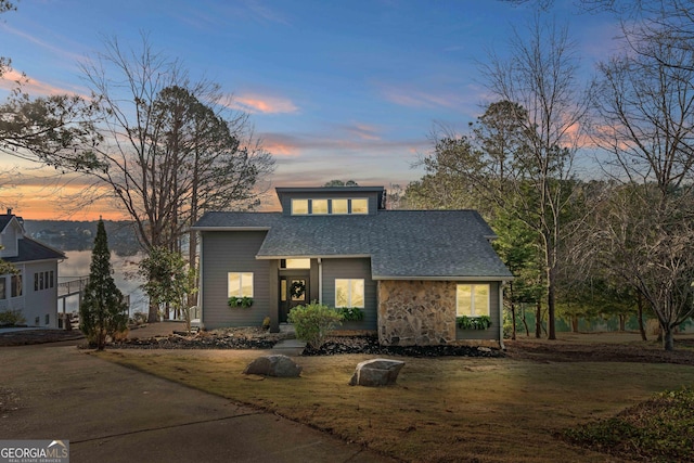 1190 Plantation Dr, Villa Rica, GA 30180 - view of front of house featuring a lawn, stone siding, and a shingled roof