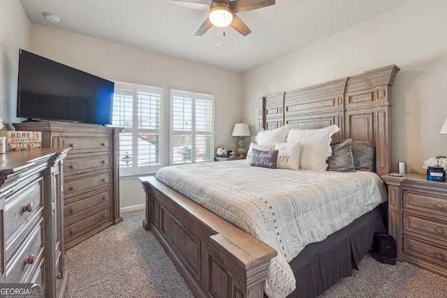 bedroom with a ceiling fan and light carpet