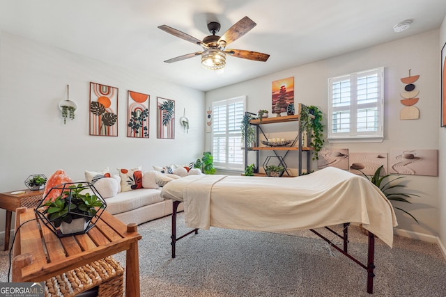 carpeted bedroom with baseboards and ceiling fan
