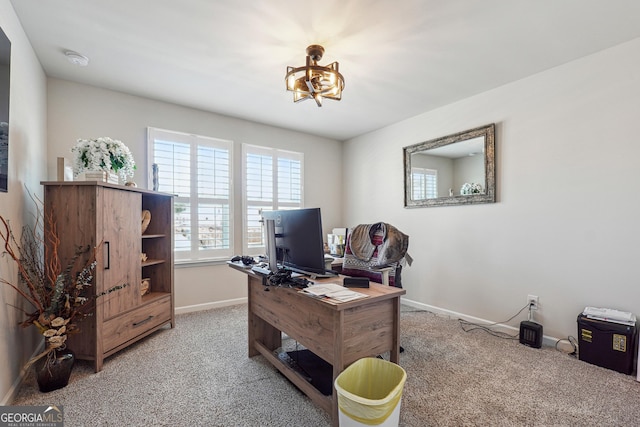 office area with a notable chandelier, carpet flooring, and baseboards