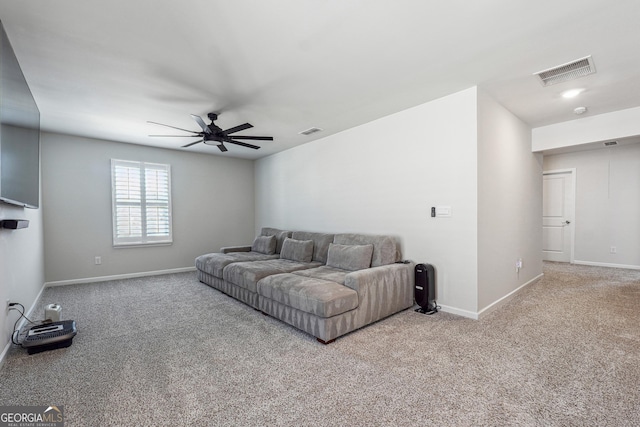 carpeted living area featuring visible vents, baseboards, and a ceiling fan