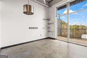 unfurnished room with baseboards