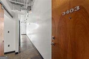 hallway featuring concrete floors