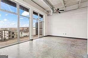 unfurnished room with baseboards