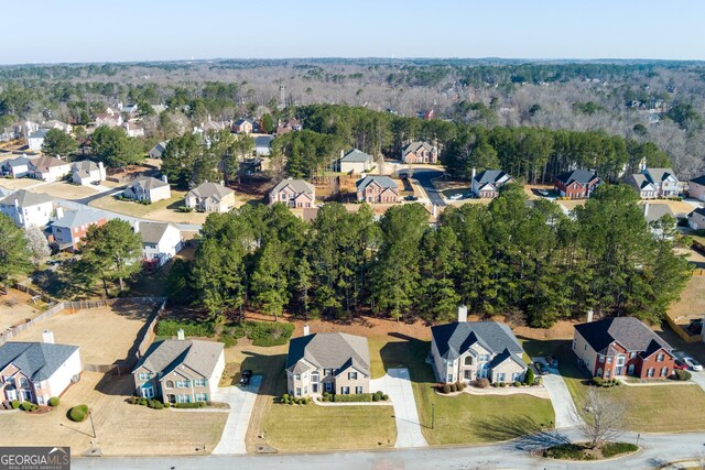 aerial view featuring a residential view and a view of trees