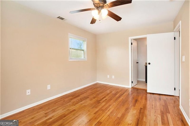 unfurnished bedroom with light wood-type flooring, visible vents, baseboards, and ceiling fan