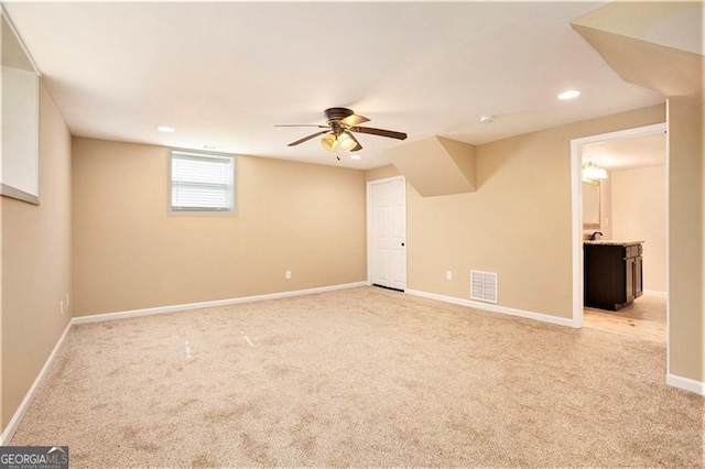 spare room with baseboards, visible vents, recessed lighting, ceiling fan, and light carpet