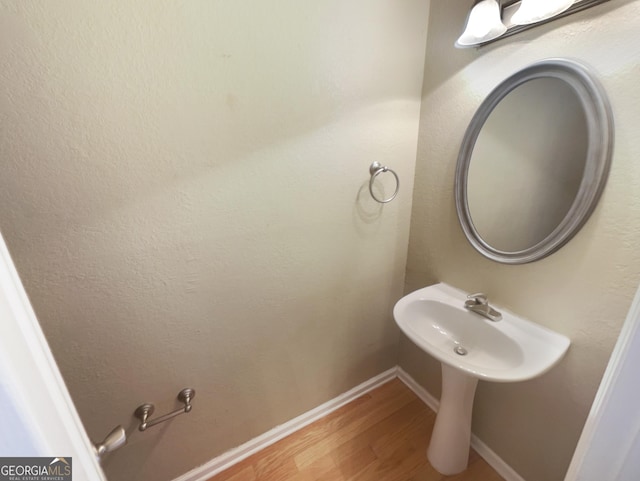 165 N River Dr Unit G, Sandy Springs, GA 30350 - bathroom featuring wood finished floors and baseboards