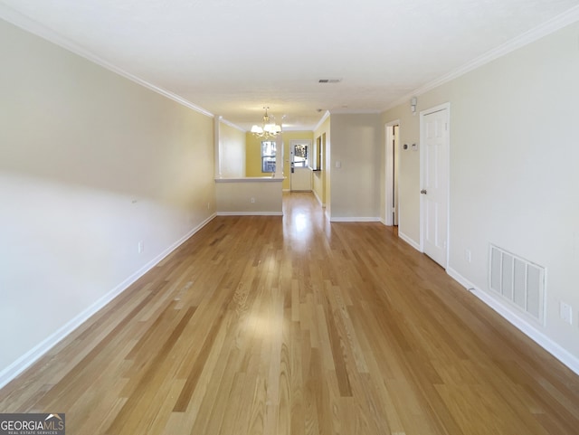 165 N River Dr Unit G, Sandy Springs, GA 30350 - empty room with a chandelier, light wood-type flooring, and ornamental molding