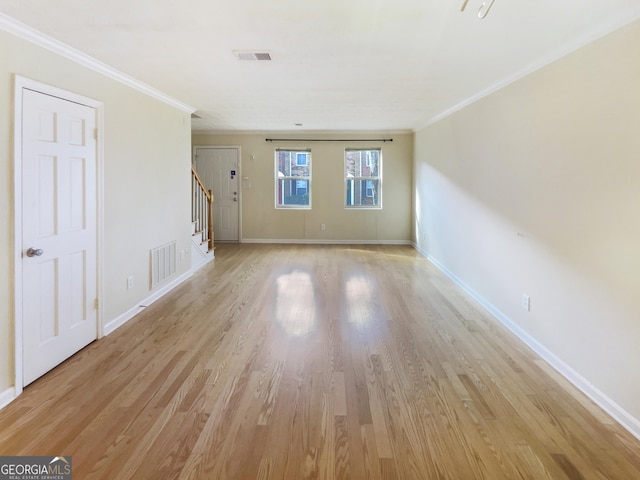 165 N River Dr Unit G, Sandy Springs, GA 30350 - unfurnished living room with stairway, light wood finished floors, and crown molding