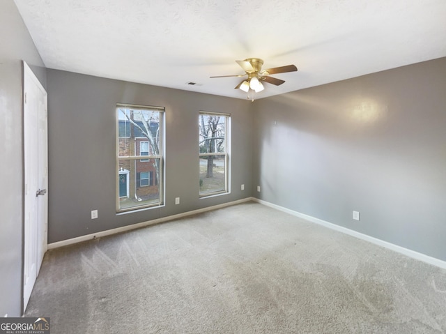 165 N River Dr Unit G, Sandy Springs, GA 30350 - spare room featuring ceiling fan and carpet flooring