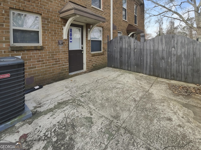 165 N River Dr Unit G, Sandy Springs, GA 30350 - view of exterior entry with brick siding and a gate