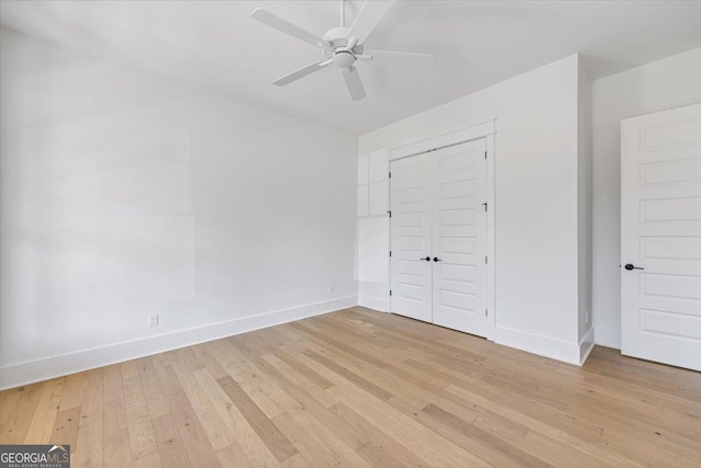 104 Piedmont Cir, Forsyth, GA 31029 - unfurnished bedroom with light wood-style floors, baseboards, a closet, and ceiling fan