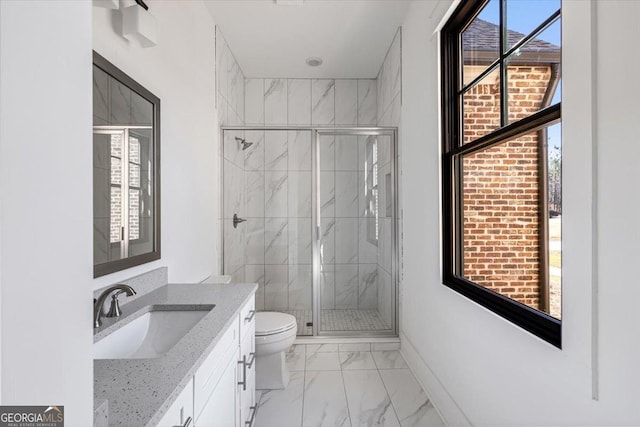 104 Piedmont Cir, Forsyth, GA 31029 - full bathroom featuring marble finish floors, a stall shower, toilet, vanity, and baseboards