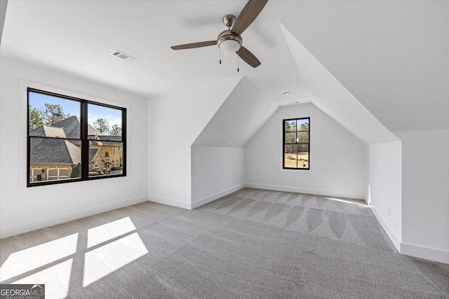 104 Piedmont Cir, Forsyth, GA 31029 - additional living space featuring light colored carpet, lofted ceiling, a ceiling fan, and baseboards