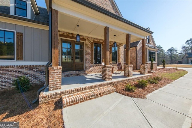 104 Piedmont Cir, Forsyth, GA 31029 - property entrance with covered porch, board and batten siding, and brick siding