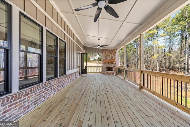 104 Piedmont Cir, Forsyth, GA 31029 - wooden deck featuring an outdoor brick fireplace and a ceiling fan