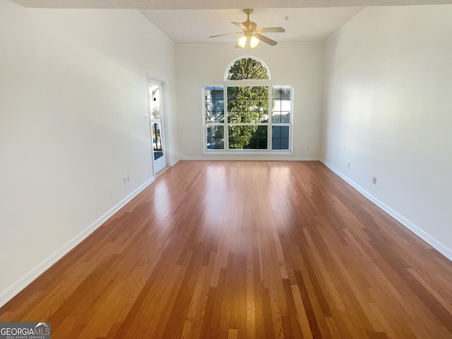 1250 Parkwood Cir SE Unit 300/230, Atlanta, GA 30339 - unfurnished living room featuring light wood-style floors, a ceiling fan, and baseboards