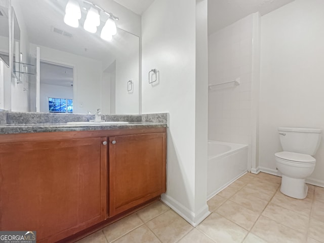 1250 Parkwood Cir SE Unit 300/230, Atlanta, GA 30339 - full bath with tile patterned flooring, toilet, vanity, and baseboards