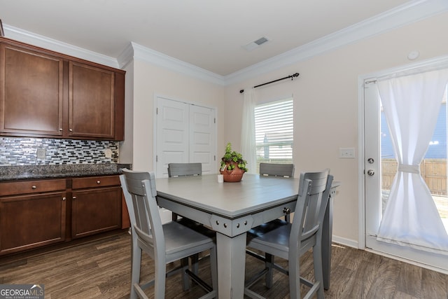3391 Meadow Grass Dr, Dacula, GA 30019 - dining room with dark wood finished floors and crown molding