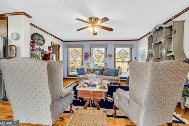 1696 Crawfords Ferry Rd, Hartwell, GA 30643 - living room with a textured ceiling, crown molding, a ceiling fan, and wood finished floors