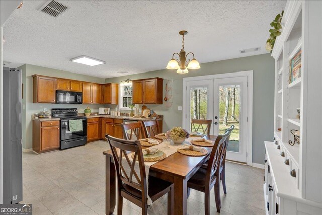 81 Summer Creek Dr, Dallas, GA 30157 - dining room featuring a notable chandelier, visible vents, french doors, and baseboards