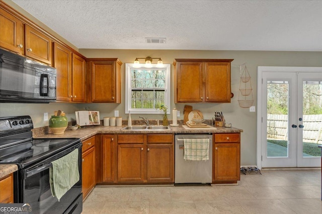 81 Summer Creek Dr, Dallas, GA 30157 - kitchen featuring visible vents, a sink, black appliances, french doors, and brown cabinets