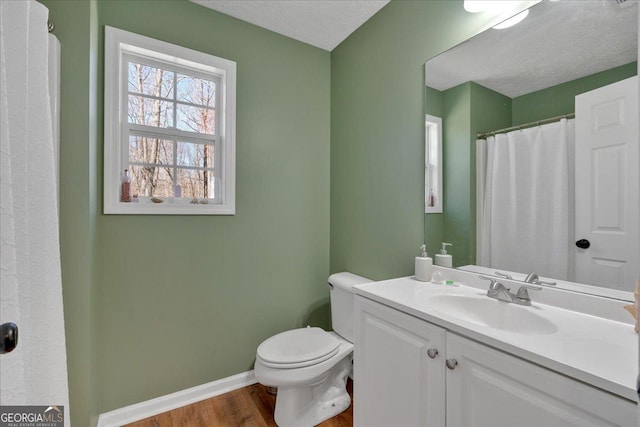 81 Summer Creek Dr, Dallas, GA 30157 - bathroom with toilet, wood finished floors, baseboards, and a textured ceiling